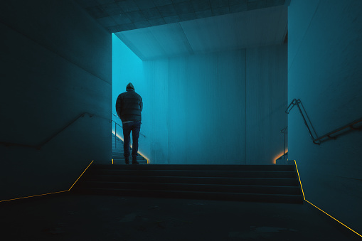 Man walking in underground corridor