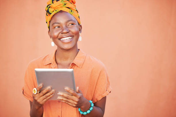 istock Black woman thinking, head scarf and tablet for connection, idea and search internet on studio background. Jamaican female, device and girl smile with traditional head wrap, reading online and mockup 1459195170