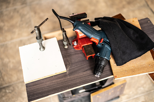 Work table with a drill on top at home