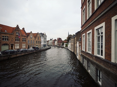 Panoramic view of river canal channel in historic city center of Bruges West Flanders Flemish Region Belgium Europe