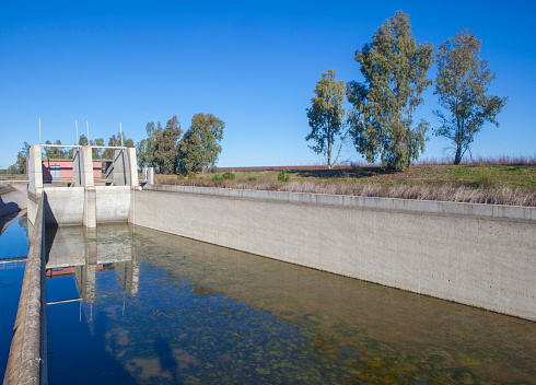 Orellana Irrigation canal in winter. Regulation dam of Vegas Altas del Guadiana, Extremadura, Spain