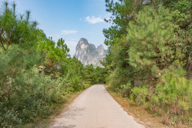 Narrow road between Karst mountains near Yangshuo.