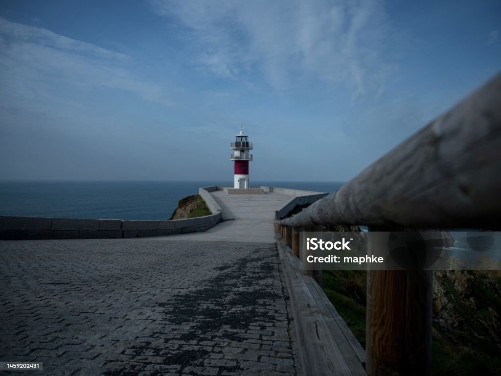 Panorama of Cabo Ortegal lighthouse on steep rocky cliff atlantic ocean bay of biscay Carino Cape Galicia Spain Panorama of Cabo Ortegal lighthouse on steep rocky cliff atlantic ocean bay of biscay Carino Cape Galicia in Spain A Coruna Stock Photo