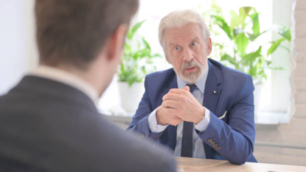 istock Unsatisfied Senior Old Businessman Talking with Businessman, Argument 1459204731