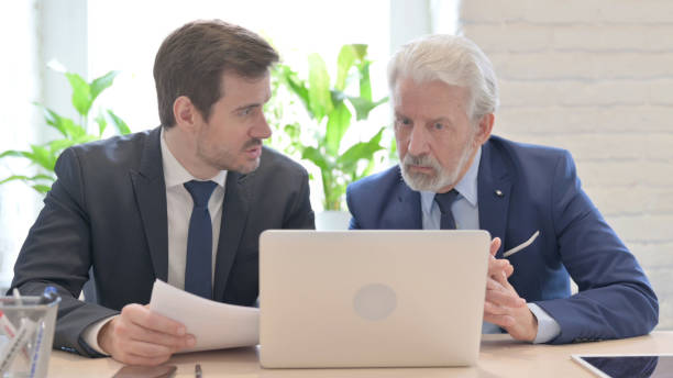 istock Business People Discussing Work on Laptop, Online Business 1459204979