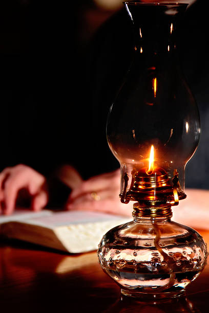 istock Reading By Vintage Oil Lamp 145920569