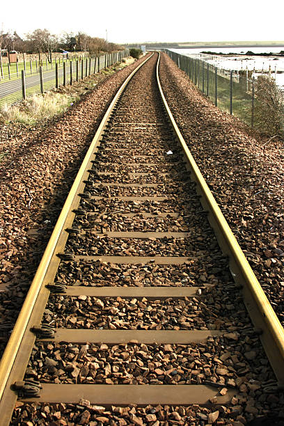 Single track coastal railway line stock photo