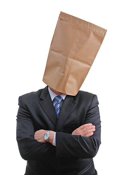 Man with a paper bag Man with a paper bag isolated on white background anonymous businessman with paper bag on his head stock pictures, royalty-free photos & images
