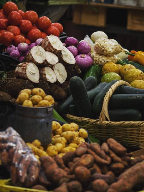 Various fruits and vegetables on display in typical indoor market Mercado 10 de Agosto in Cuenca Ecuador South America stock photo