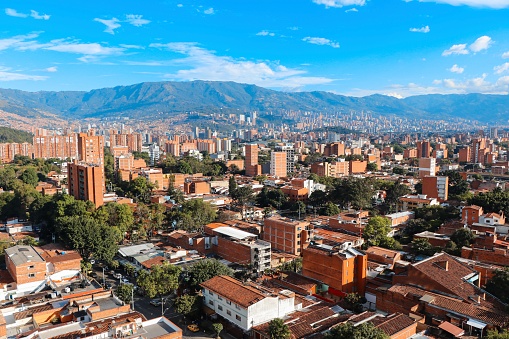 Panoramic view to Medellin, Laureles and El Poblado districts, Colombia, sunny day with clear blue sky