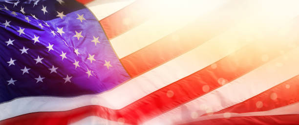 istock Blurred motion American Flag and light beam background 1459212198