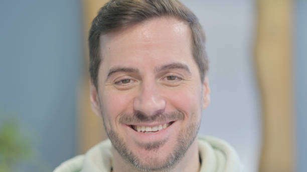 istock Close Up of Smiling Young Man Face 1459216384