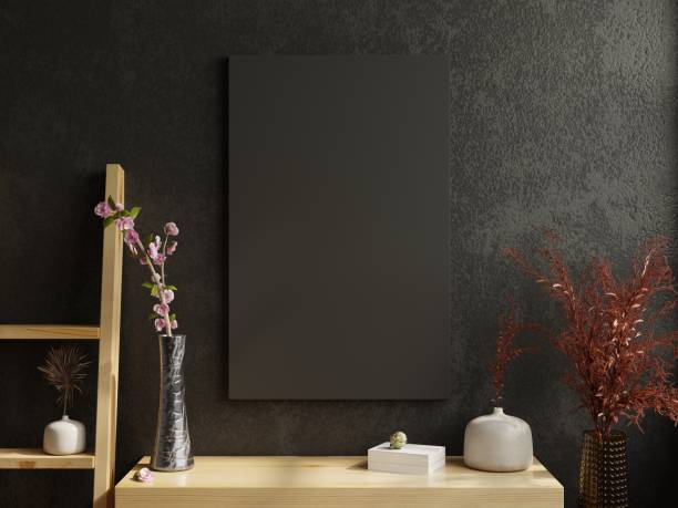 istock Mockup frame on wood cabinet in living room interior on empty dark wall. 1459216420