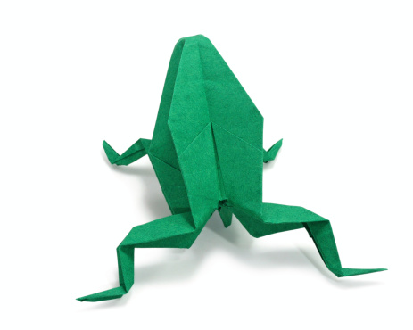 origami frog on white background, close up