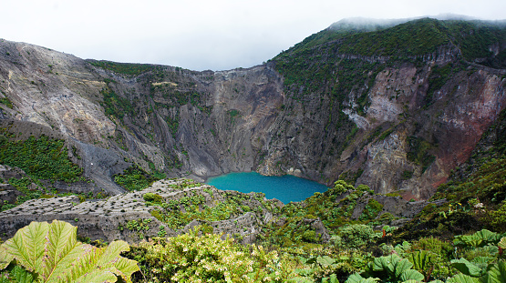 Irazu volcano in Costa Rica with a lake of green water formed in its crater