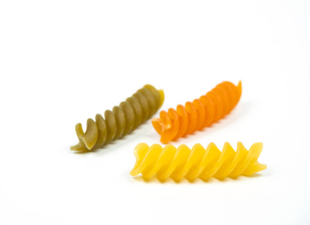 Fusilli pasta displayed on white background