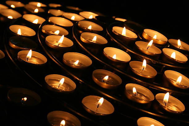 istock Charity. Praying candles in a temple. 145923297