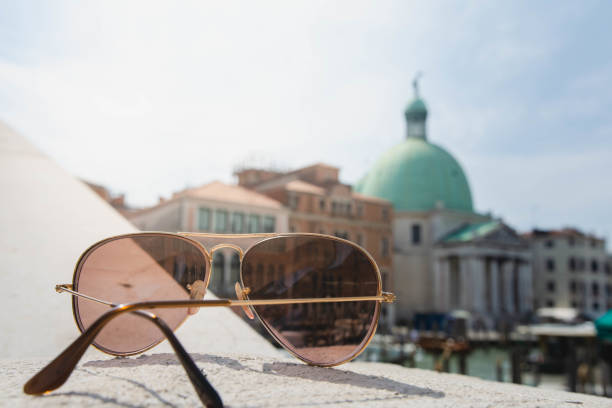 sunglasses on the Venice bridge in springtime stock photo