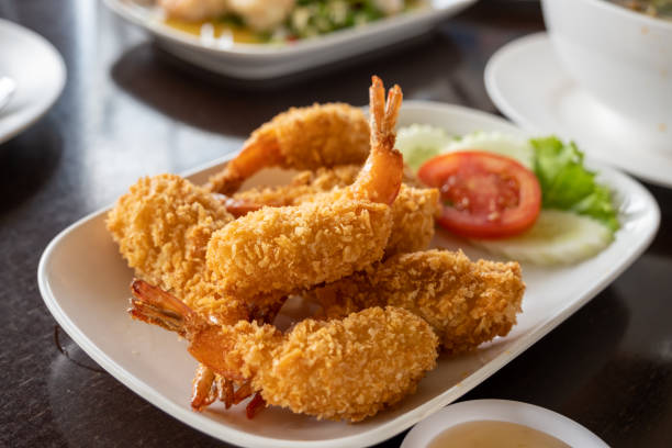 istock The whole fried chicken is chopped into pieces and placed in a white plate placed on the table. 1459235773