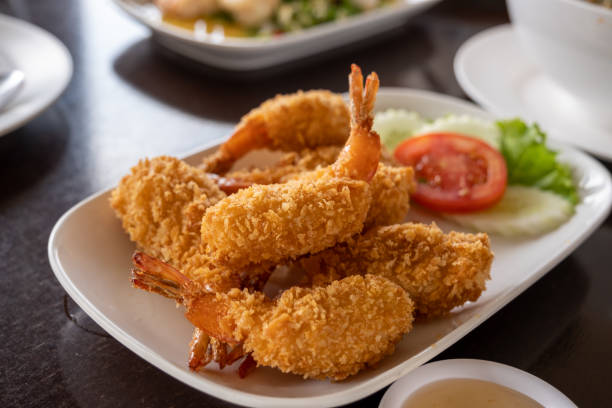 istock The whole fried chicken is chopped into pieces and placed in a white plate placed on the table. 1459235780