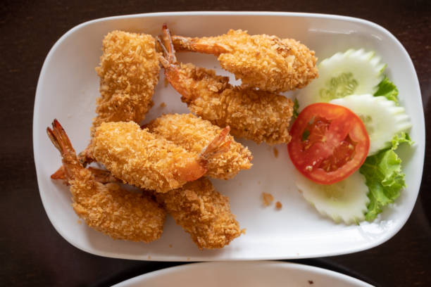 istock Fried shrimp or Tempura Shrimps in white plate on the table 1459236289