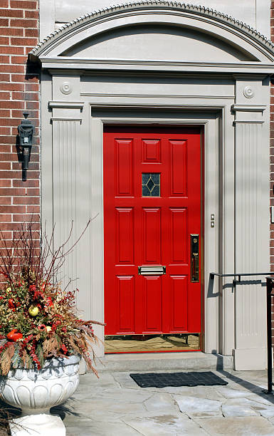 istock Red door with brass trim 145923642