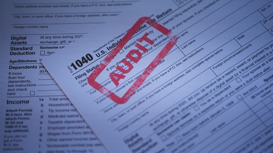 1040 IRS Tax Form video clip with a red ink stamp (Audit)