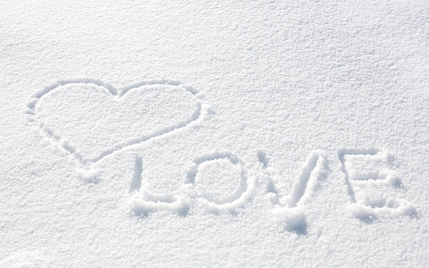 Heart on the snow stock photo