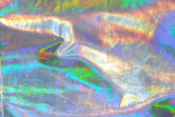 istock Holographic background.metallic fabric texture with iridescent gradients. texture with iridescent waves and folds.Abstract trendy holographic background 1459246353