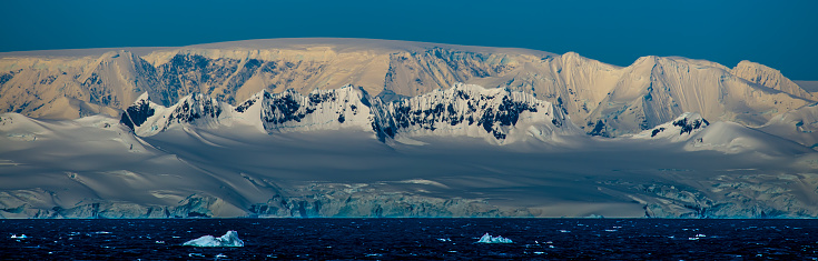 Antarctic glacier from the melting Larsen B iceshelf (Antarctic Peninsula) with impressive cravasses. One can see the last remains of the formerly huge iceshelf which totally collapsed in 2002. Picture was taken from helicopter at a 3-month research expedition.