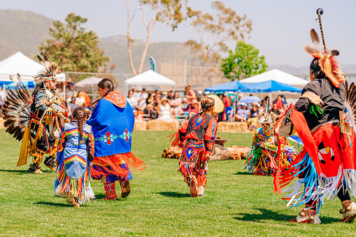 Malibu, California, USA - April 9, 2022. A Pow Wow is an American Indian social gathering or fair which usually includes competitive dancing or discussions. Annual Chumash Day Powwow.