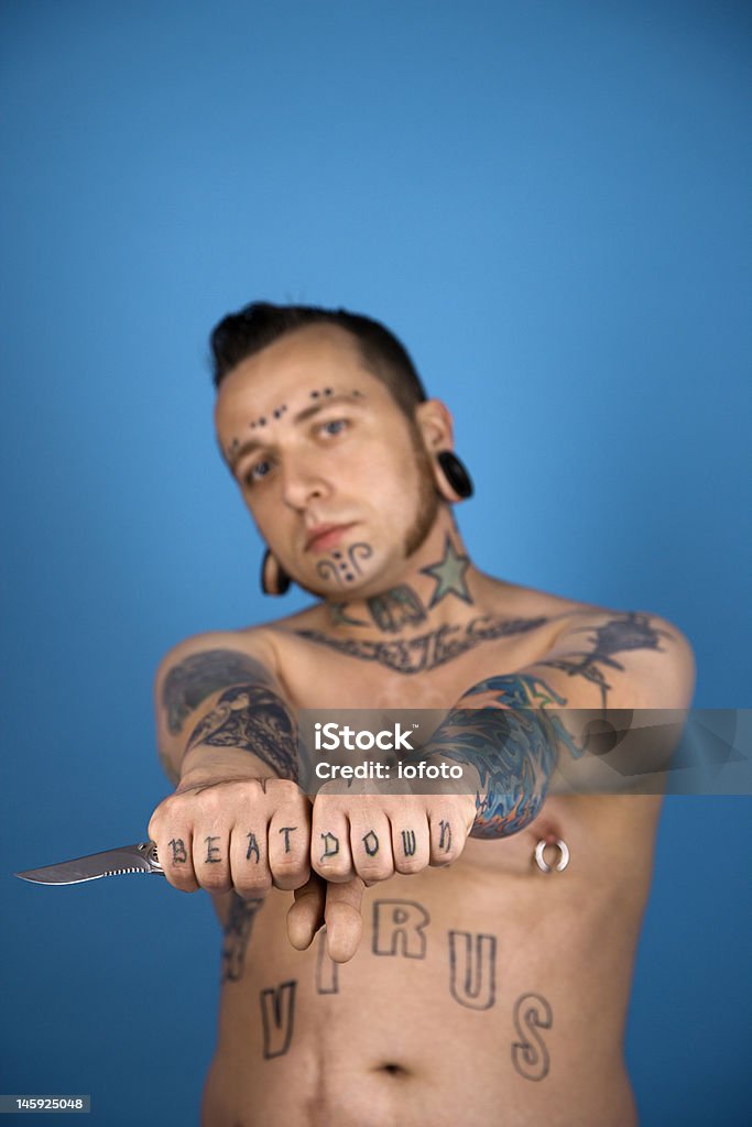 Tattooed Man Holding Knife Stock Photo - Download Image Now - Tattoo,  Sideburn, Knuckle - iStock