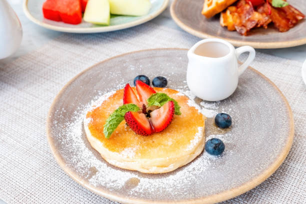 istock Buttermilk pancake topped with fresh berries and drizzled with maple syrup 1459253565