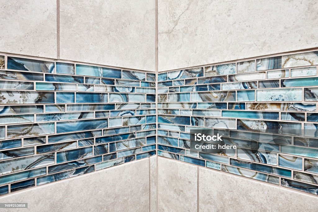 Shower blue mosaic detail Shower blue mosaic detail on tile wall Bathroom Stock Photo