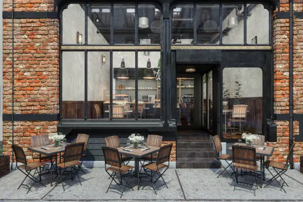 Photo of Entrance Of Coffee Shop With Tables And Chairs On Sidewalk