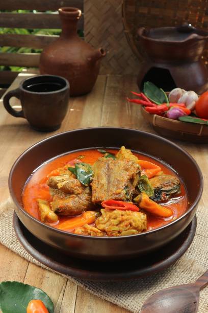 istock fish stew and spicy tofu dish on cup and teapot background 1459255487