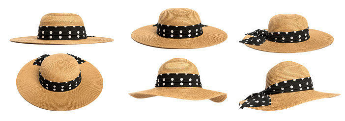 Set with womens straw hats decorated with black polka dot ribbon on a white background.