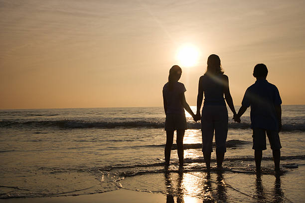 istock Mom and kids at beach. 145925897