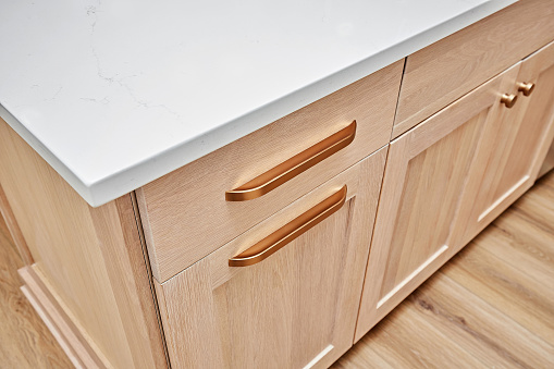 Drawer handle details in wooden cabinet