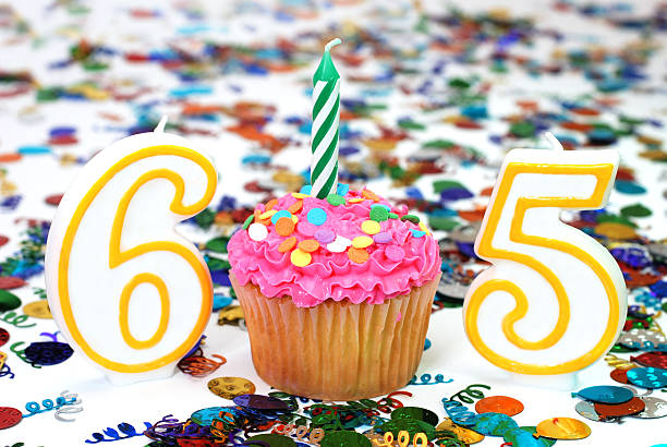 istock Celebration Cupcake with Candle - Number 65 145925984
