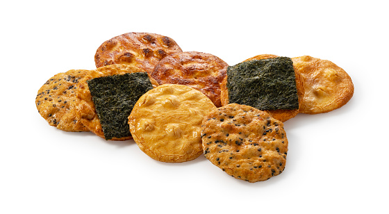 Sembei rice crackers placed on a white background. Senbei is a Japanese snack.