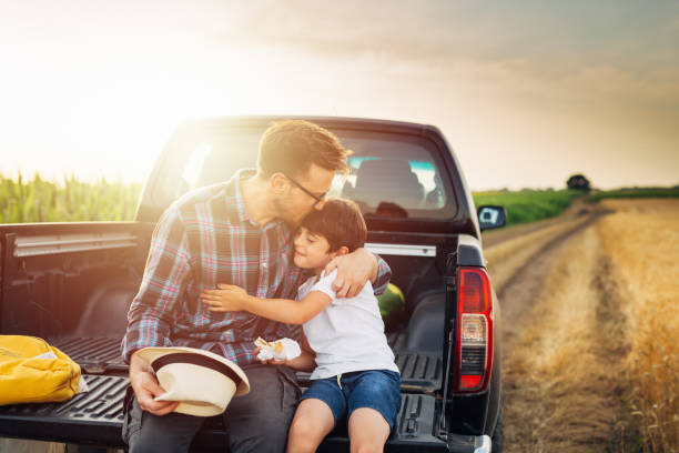 istock father and son outdoor on field 1459265574