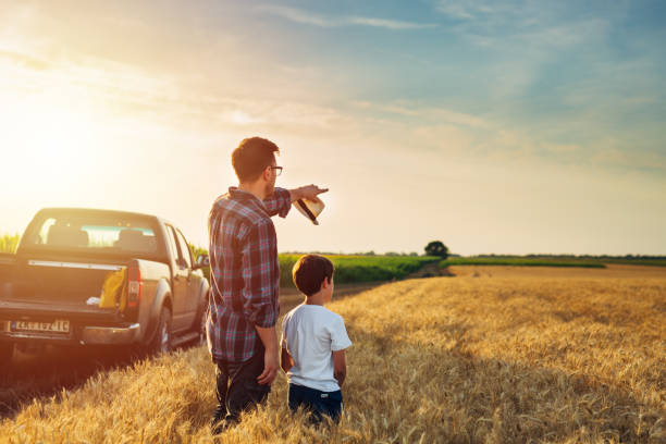 istock father and son outdoor on field 1459265622