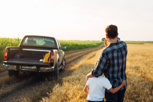 istock father and son outdoor on field 1459265626