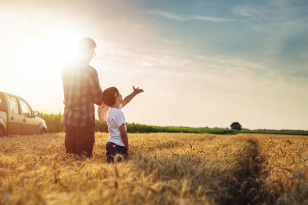 istock father and son outdoor on field 1459265628