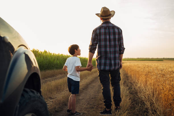 istock father and son outdoor on field 1459265694