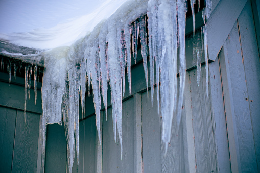 Close ups of icicles hanging off a building roof in the winter season. Shot on Mount Hood in Oregon.