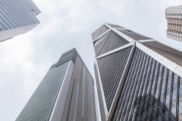 Kuala Lumpur, Malaysia - November 25, 2019: Kuala Lumpur downtown, modern office high rise buildings are under bright cloudy sky