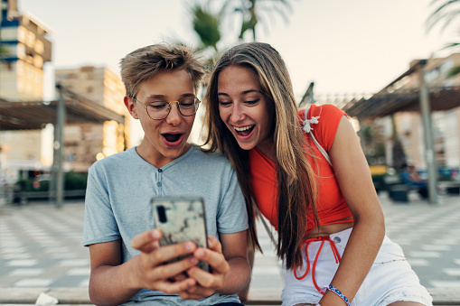 Teenagers checking social media on beach promenade of Alicante, Spain
Sunny summer day.
Canon R5