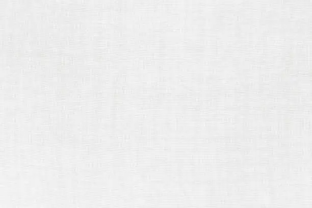 Photo of White linen fabric cloth texture for background, natural textile pattern.